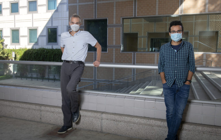 Tryphon Georgiou, left, UCI Distinguished Professor of mechanical and aerospace engineering, worked with postdoctoral scholar Amirhossein Taghvaei, right, on a project concluding that the use of fractional exponents in epidemiological models produces more accurate predictions about the spread of infectious diseases, especially in the early stages of the epidemic. Steve Zylius / UCI