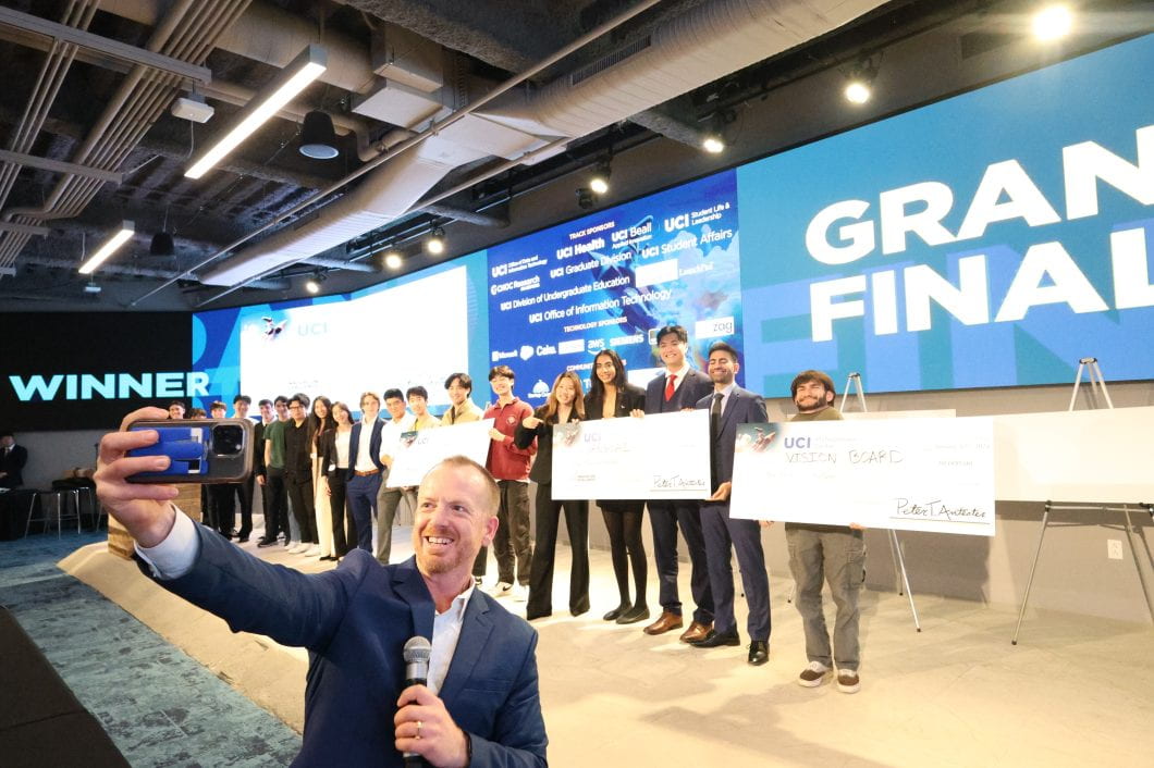 ANTrepreneur Center director Ryan Foland takes a selfie with participants in the AI Innovation Challenge. Angie Delfin / ANTrepreneur Center