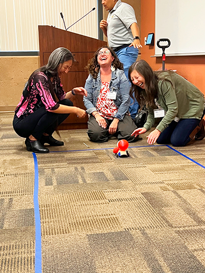 Working in teams, alumni enjoyed the balloon-powered rocket challenge.