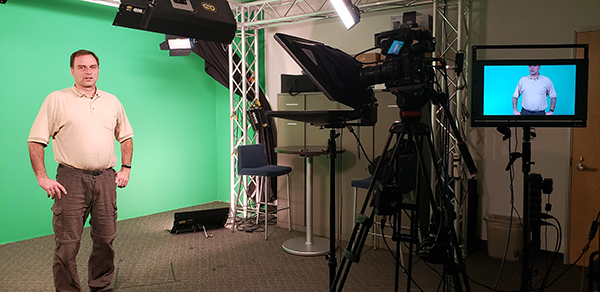 James Brody, associate professor of biomedical engineering, records his popular BME3 class sessions in the UCI recording studio. 