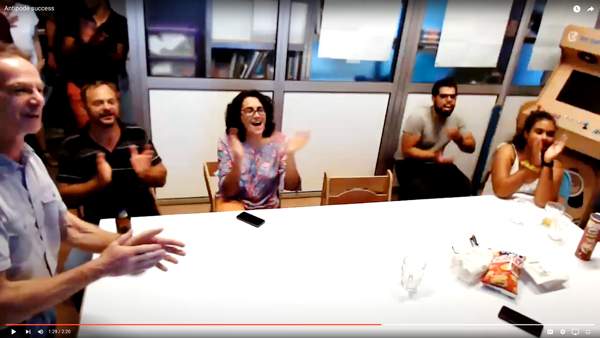 Patrick Jeanty (left) and colleagues applaud their world record winning feat, successfully piloting an internet-connected drone in Irvine, from the French Island of Réunion,  11,440 miles away.