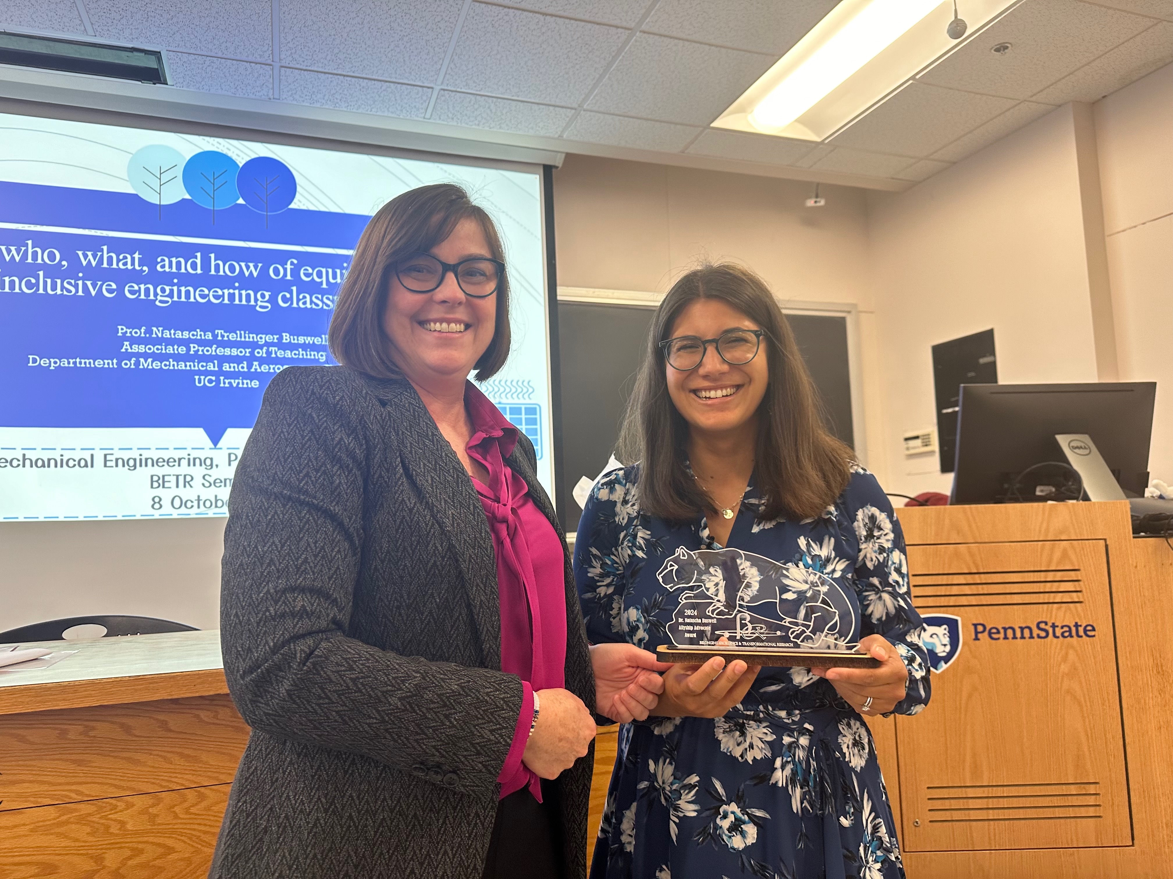 Natascha Buswell (right) accepts the Belonging Excellence and Transformative Research (BETR) Allyship Advocate Award from Pennsylvania State University’s Mechanical Engineering Department Chair Mary Frecker.