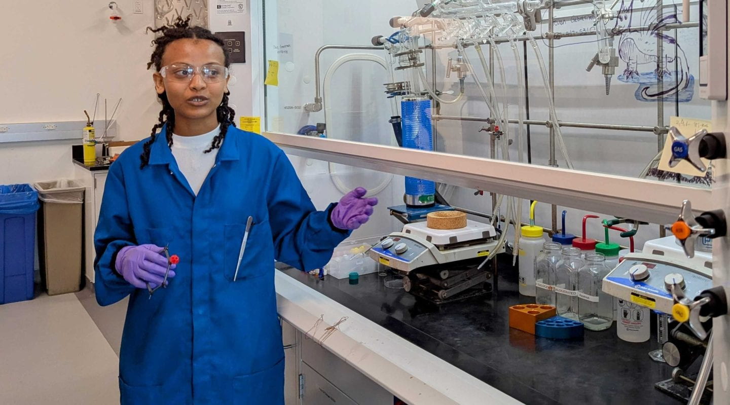 Feven Leake Gebresilassie, a first year graduate student in the laboratory of Jenny Yang, professor of chemistry, discusses her research into creating molecules to capture carbon dioxide from the atmosphere, turning a leading cause of climate change into a useful commodity. Tatiana Overly / UC Irvine