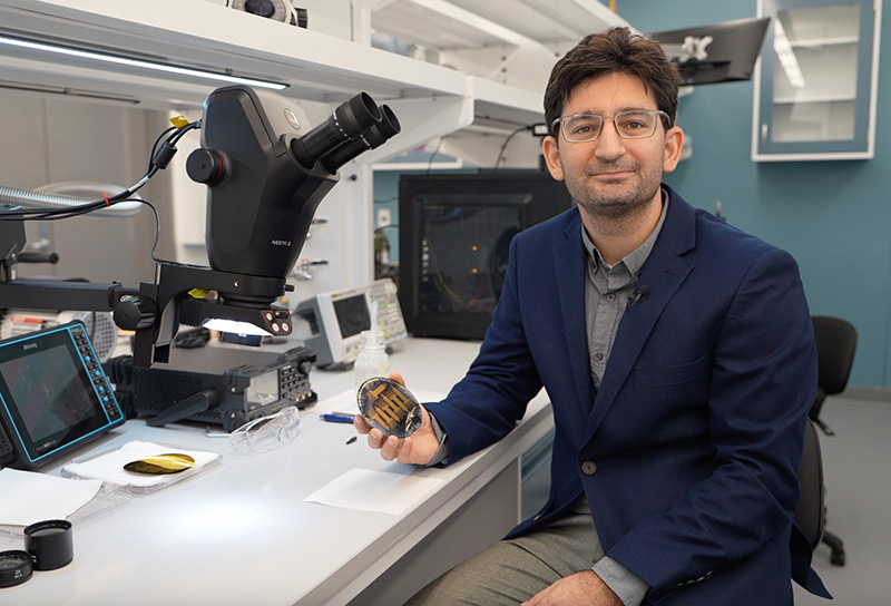 Dion Khodagholy holds neural soft electronics in his UCI lab.