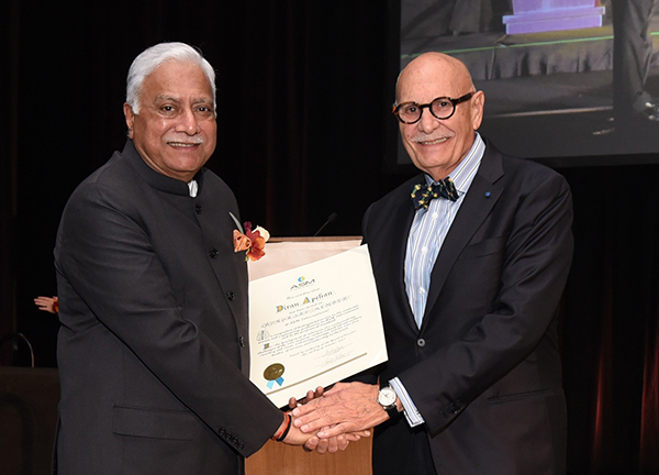 ASM International’s past president, Pradeep Goyal (left), presents honorary membership to UCI Distinguished Professor Diran Apelian.