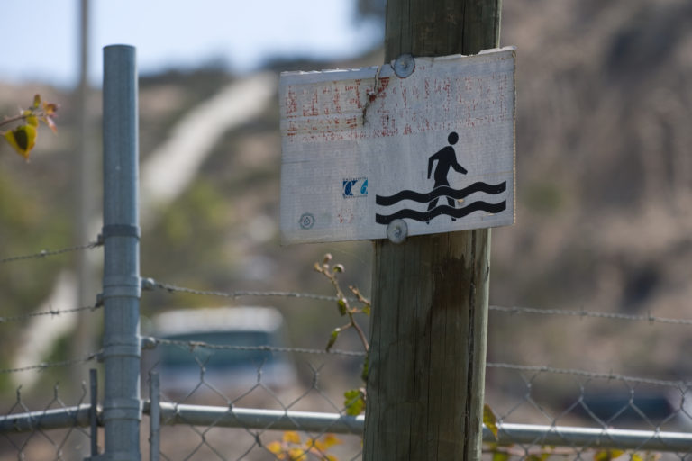 Placards posted in the Tijuana River Valley at the U.S.-Mexico border near San Diego warn of the hazards of flooding. A risk management project developed by UCI civil engineers and social scientists demonstrated the efficacy of a new collaborative flood modeling approach in addressing the threat of rising waters. Steve Zylius / UCI