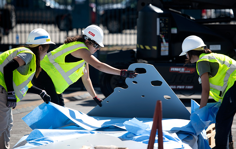 Female students putting the home together at the 2023 OC Sustainability Decathlon. (Photo: Steve Zylius/UC Irvine)