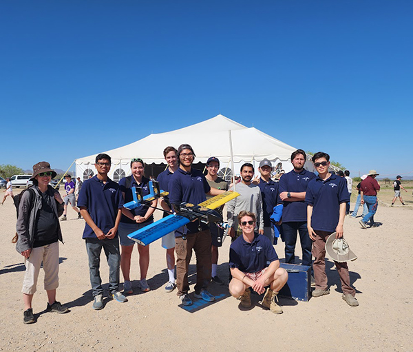 The UCI Design, Build, Fly team completed all three missions at the international competition in Arizona. Pictured, from left, are Assistant Professor Jacqueline Huynh, Rahul Donnaganti, Lucia Benjamin, Linus Fischer, Luis Zamora, Chaz Fazio, Daniel Steiner, Deepak Gupta, Chang Lee, Brandon Hrafnsson, Haoyi "Hardy" Wang. Not pictured: Eric Cheng, Jerome Masicat, Minas Minasyan, Parker Hemmings, Raymond Dunn. 