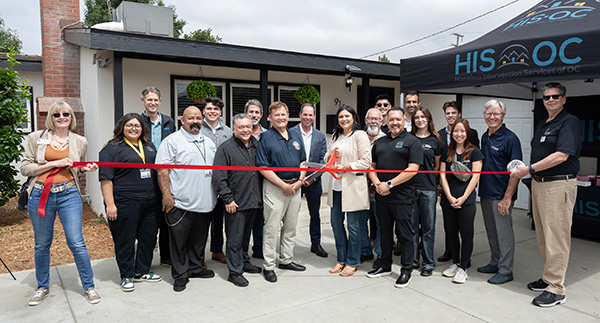 The HIS-OC ribbon cutting ceremony as they begin to move the modular home to their lot