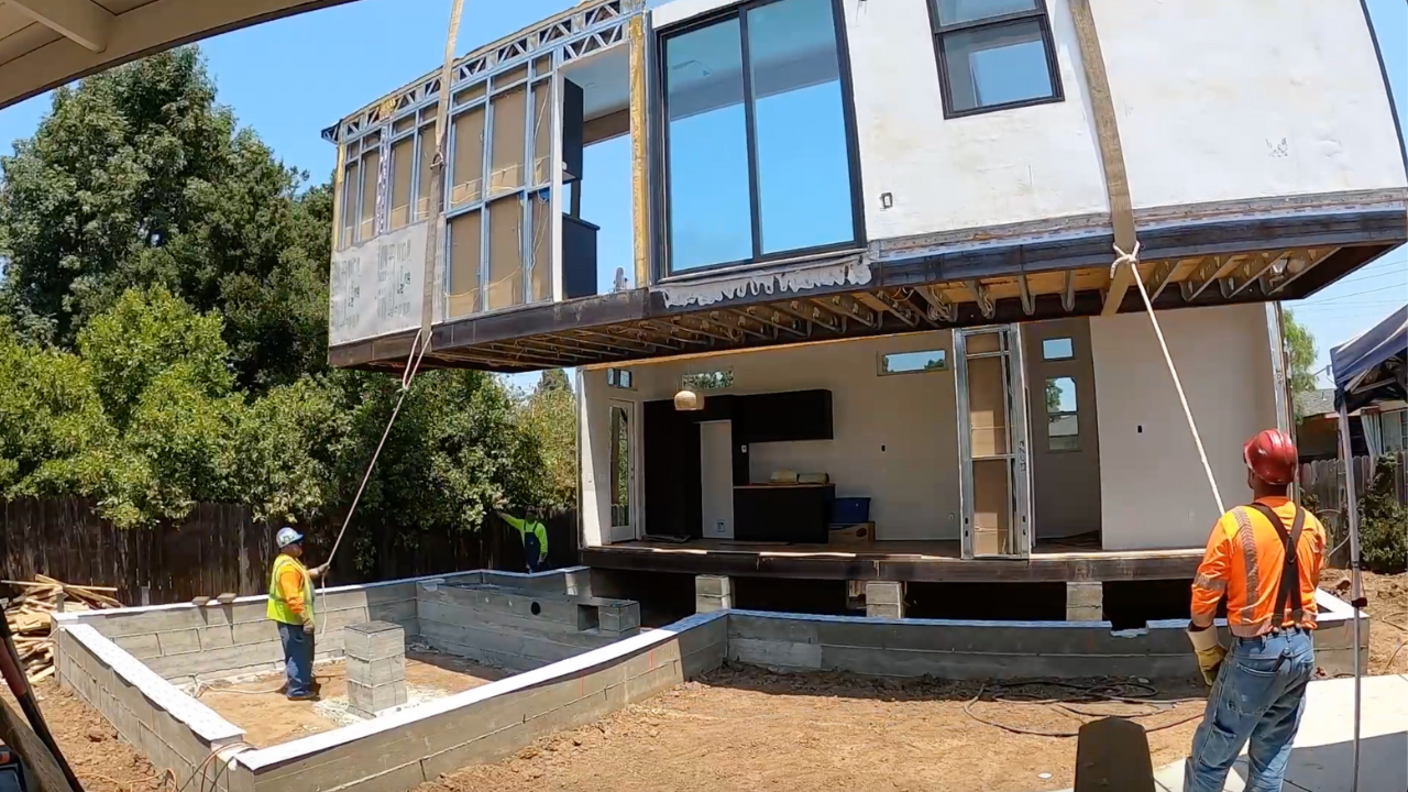 The four modules of the home moving to the center's backyard