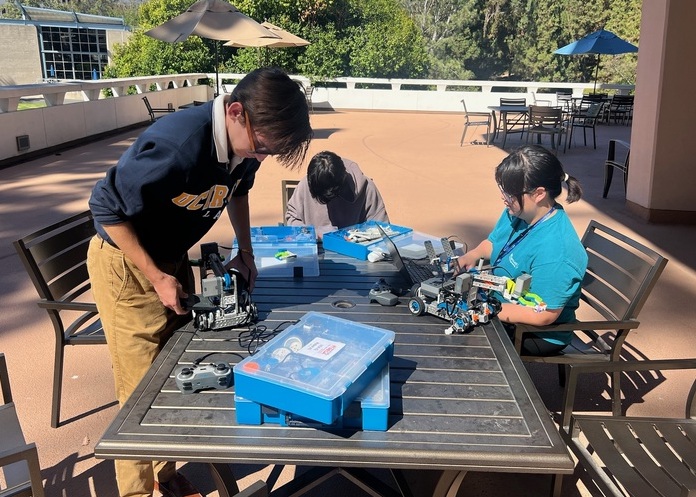 Students work on constructing and programming a custom VEX robot for the competition.