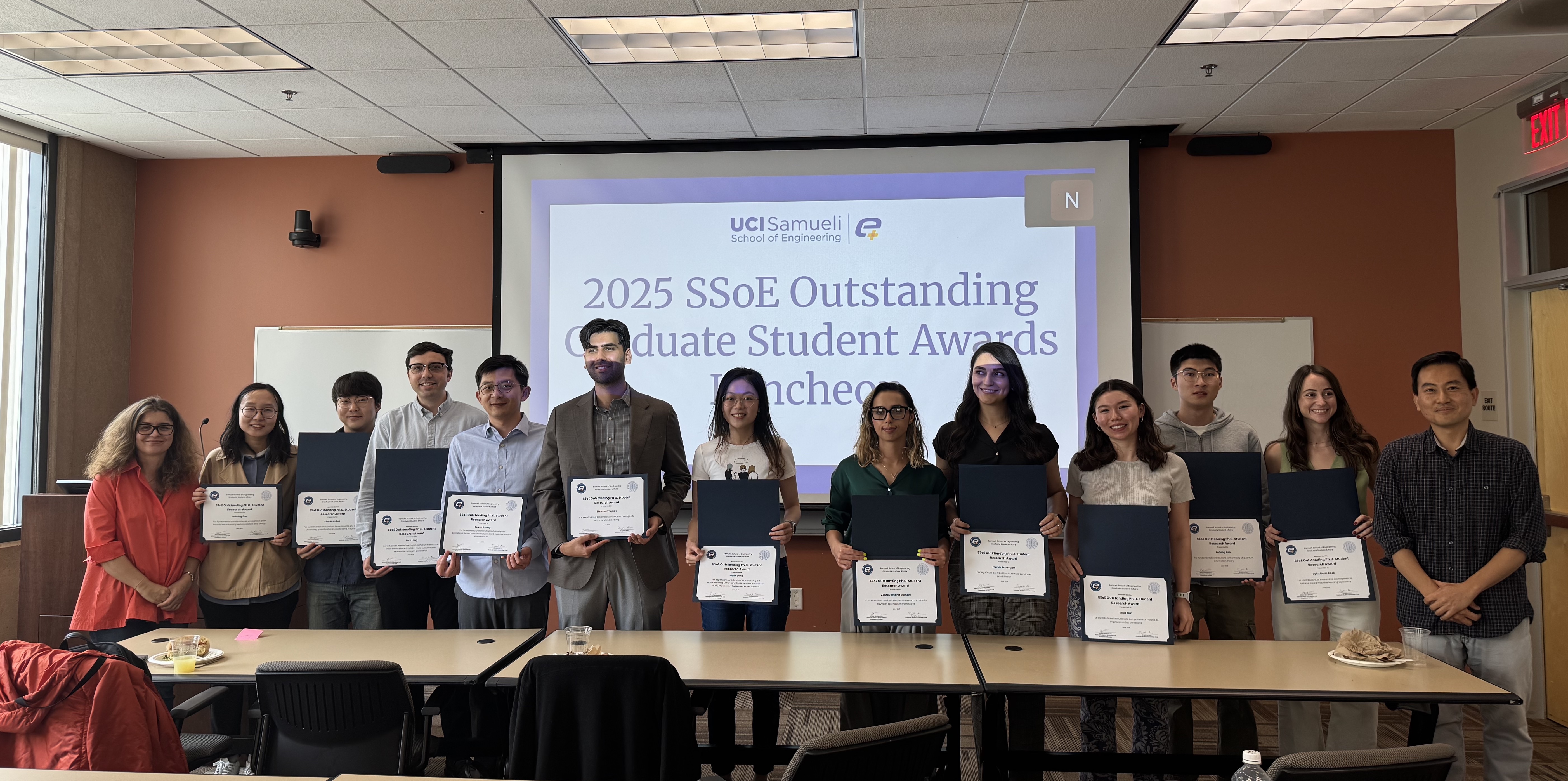 Outstanding Graduate Student Award winners and runner-ups accompanied by Athina Markopoulou (far left) and SungWoo Nam (far right)