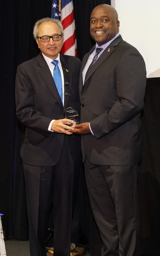 Dean Gregory Washington and Engineering Ingenuity Award winner Jai Hakhu.