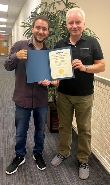 Recent mechanical and aerospace engineering alumnus David Morata (left) and his mentor Professor Dimitri Papamoschou celebrate their AIAA Best Paper Award.