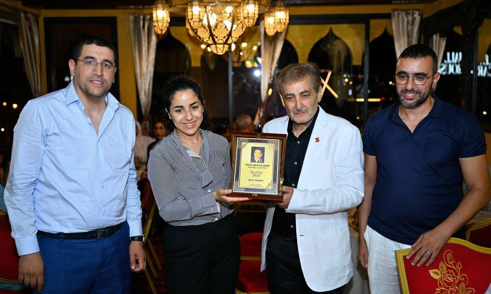 Pictured, from left, are Conference General Chair Brahim El Bhiri, Ms.  Aboutajdine, daughter of the late Driss Aboutajdine, Ayman Mosallam and Conference Co-Chair Anis Moumen. 