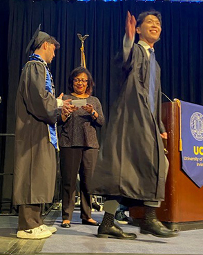 On stage at the 2024 UCI Samueli School of Engineering Commencement, Robin Jeffers assists graduating students for the last time.