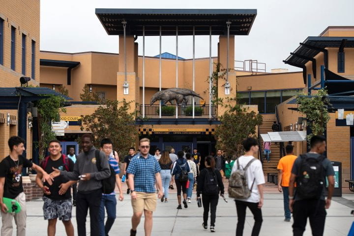 Photo of students walking around UC Irvine campus.