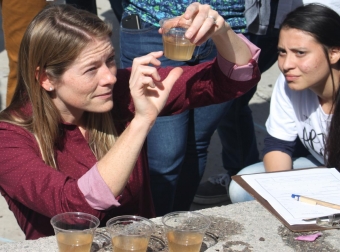 Assistant Professor Kristen Davis judges the water filtration competition