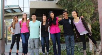 Michelle Khine and students form A Hundred Tiny Hands