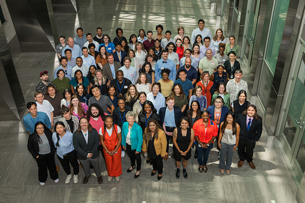 Swanson, pictured center in cream- colored sleeveless top, attended the U.S. Digital Corps orientation in Washington, D.C.,  in August 2023. She is one of 48 fellows selected this year.