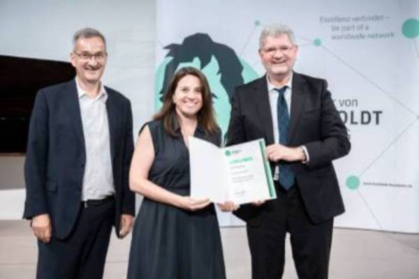 Iryna Zenyuk (center) being presented with the Friedrich Wilhelm Bessel Research Award
